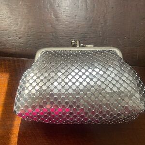 Silver tone mesh clutch/pouch.
